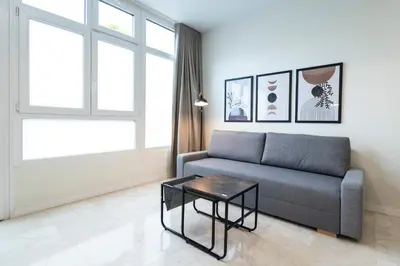 a living room with a couch and a table at Vera Garden by Concept Flats in Valencia