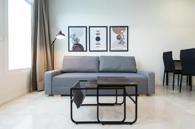 a living room with a couch and a table at Vera Garden by Concept Flats in Valencia