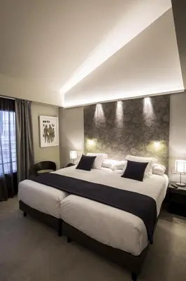 a large bedroom with a large bed in it at Vincci Mercat in Valencia