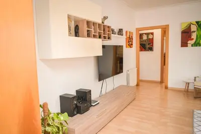a living room with a flat screen tv on a wall at Sunny House La Eliana in La Eliana