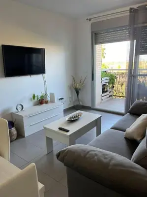 a living room with a couch and a table at Apartamento en Moncofa in Moncófar