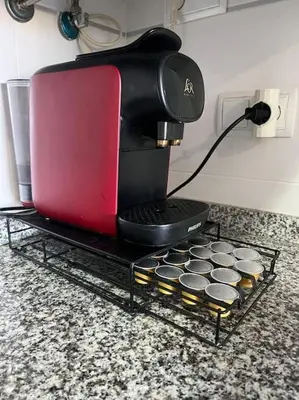 a coffee maker sitting on a table with muffins at Apartamento en Moncofa in Moncófar