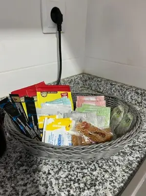 a basket filled with books and other items on a counter at Apartamento en Moncofa in Moncófar