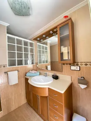 a bathroom with a sink and a mirror at Guesthouse in Torrent in Valencia