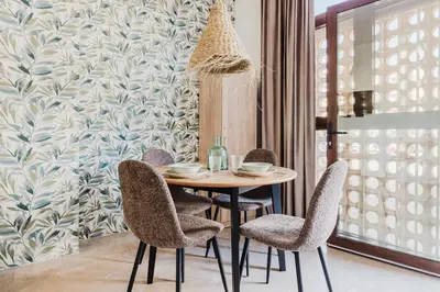 a dining room with a table and chairs at Loft Viñas in Valencia