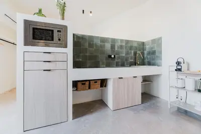 a kitchen with a sink and a microwave at Loft Viñas in Valencia