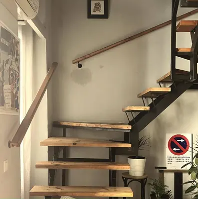 a staircase with wooden treads in a house at Duplex Loft And Home Office 140m2 plus a 70m2 Terrace in Valencia