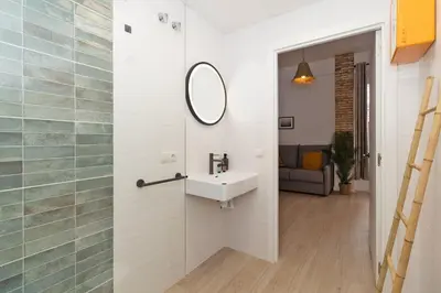 a bathroom with a sink and a mirror on the wall at Illetes Flats -Apartamento con mucho encanto in Valencia