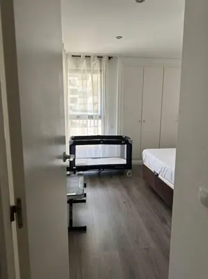 a room with a bed and a room with a window at Apartamento playa Veramar patacona in Valencia