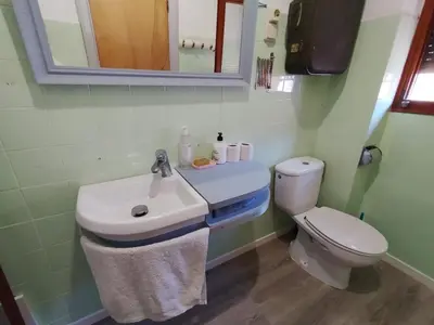 a bathroom with a sink and a toilet at rural relax Valencia in Villar del Arzobispo
