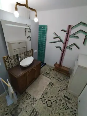 a bathroom with a toilet and a sink and a mirror at rural relax Valencia in Villar del Arzobispo