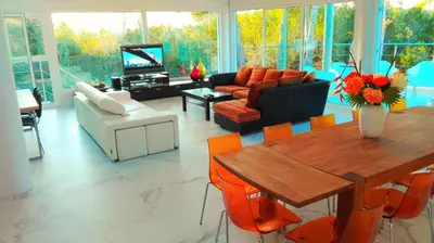 a living room with a couch and a table at All Nature Villa-25min from Valencia in Valencia
