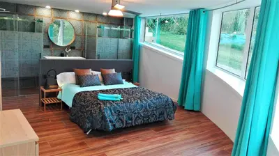 a bedroom with a bed and a bath room at All Nature Villa-25min from Valencia in Valencia
