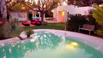 a small swimming pool in a yard with a house at All Nature Villa-25min from Valencia in Valencia