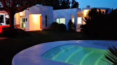 a house with a hot tub in front of a house at All Nature Villa-25min from Valencia in Valencia