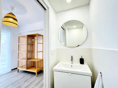 a bathroom with a sink and a mirror at NUEVO, a 90 metros de la playa y con vistas al mar in Cullera