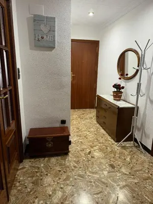 a room with a dresser and a mirror and a door at Casa Rural Piker in Bolbaite
