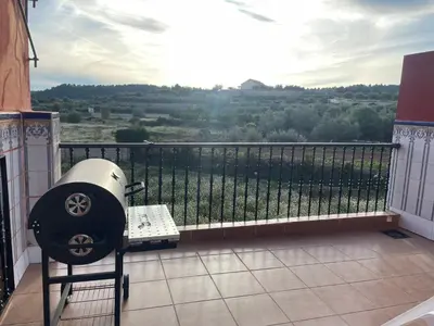 a room with a balcony with a view of a field at Casa Rural Piker in Bolbaite