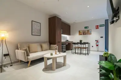 a living room with a couch and a table at VLC HOST - Luz Casanova in Valencia
