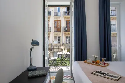a hotel room with a bed and a large window at SingularStays Ca Iconic Living in Valencia