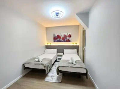a room with two beds in a room at Arquitecto D in Valencia