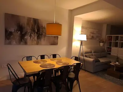 a dining room table and chairs in a living room at Explore Valencia! Tirant, city of science & Ruzafa in Valencia