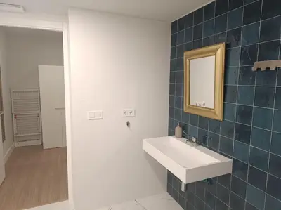 a bathroom with a sink and a mirror at Explore Valencia! Tirant, city of science & Ruzafa in Valencia