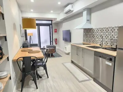 a kitchen and dining room with a table and chairs at Valencia experience! Plus,science city & Ruzafa in Valencia