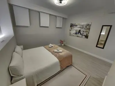 a small room with a bed and a couch at Valencia experience! Plus,science city & Ruzafa in Valencia