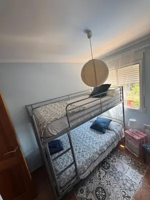 a bunk bed with a lamp on top of it at La Casa del Olivo en Montserrat - Valencia in Valencia
