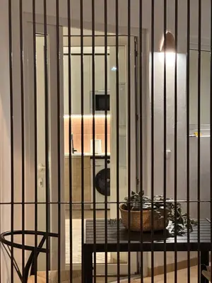 a cage with a plant on a table in a room at Apartamento mediterráneo in Valencia