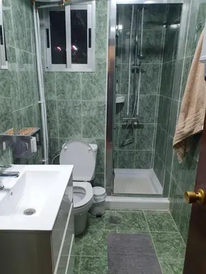 a bathroom with a shower and a toilet and a sink at Cosy apartment near the beach in Cullera