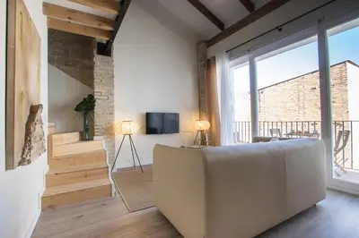 a living room with a couch and a large window at MD Jorda Roig Arena in Valencia