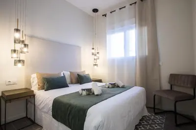 a bedroom with a large bed with a window at MD Jorda Roig Arena in Valencia