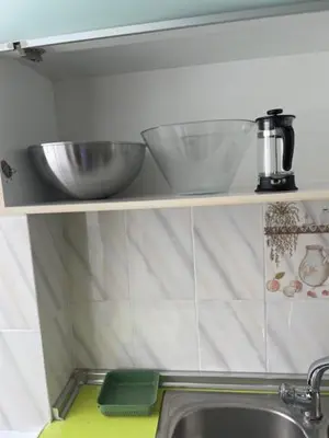 a kitchen with a sink and a mixer on a shelf at Tranquila y Céntrica Habitación Matrimonio en Vivienda Compartida in Valencia