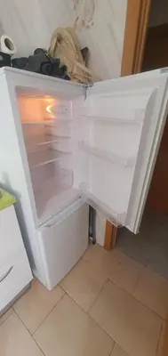 an empty refrigerator with its door open in a kitchen at Tranquila y Céntrica Habitación Matrimonio en Vivienda Compartida in Valencia