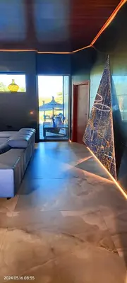 a bedroom with a bed with a triangle on the floor at The Blue Diamond Villa-25min to Valencia in Turís