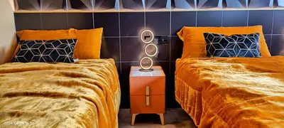 a bedroom with two beds and a mirror between them at The Blue Diamond Villa-25min to Valencia in Turís