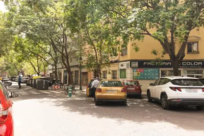 a group of cars parked on the side of a street at GuestReady - Lovely flat by Valencia University in Valencia