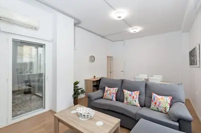 a living room with a couch and a table at GuestReady - Lovely flat by Valencia University in Valencia