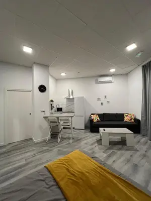 a living room with a couch and a table at Gran loft - A in Valencia