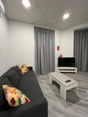 a living room with a couch and a coffee table at Gran loft - A in Valencia