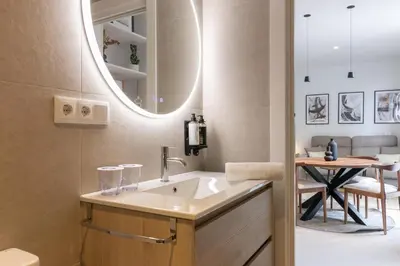 a bathroom with a sink and a mirror at Dorm4You Arena in Valencia