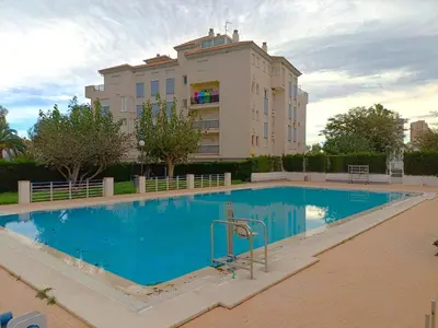 a large swimming pool in front of a building at Play-Puig Beach Flat in El Puig