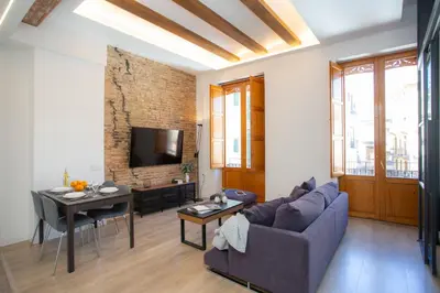 a living room with a couch and a table at SingularStays Plaza Redonda II in Valencia