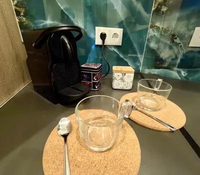 a table with a spoon and two glass bowls on it at Elegante y nuevo in Valencia