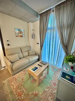 a living room with a couch and a table at Elegante y nuevo in Valencia
