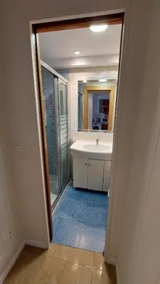 a bathroom with a sink and a mirror at Playa, relax y parking público cerca - Ideal parejas in Cullera