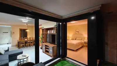 a room with a bedroom and a living room with a bed at Non Stress Seven Up in Valencia