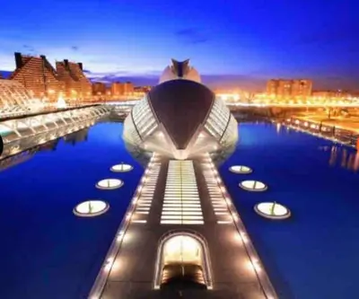 a view of the building at night at ruzafa oceanograf science center in Valencia